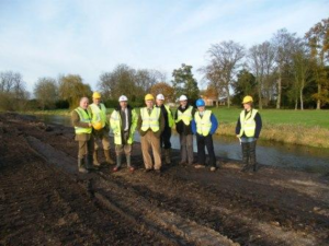 A group of Board members out onsite in high vis clothing