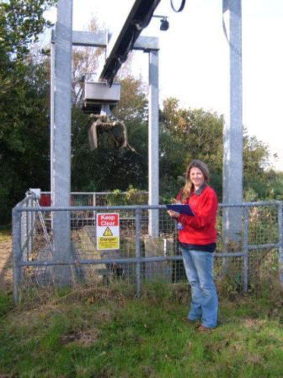 A member of the Water Management Alliance’s Environmental Team surveying a Weed Screen