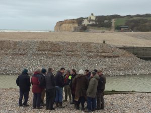 A group of Board members visiting the mouth of the River Cuckmere