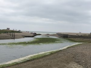 The build-up of shingle at the mouth of the Cuckmere River